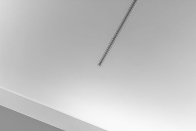 Low angle view of vapor trail against clear sky