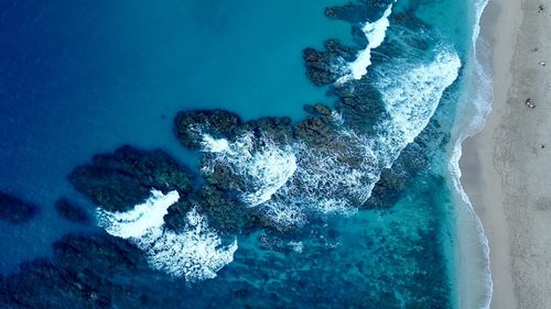 High angle view of man surfing in sea