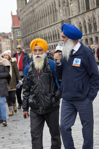 People walking on street in city