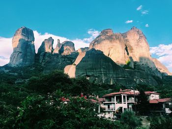 Panoramic view of buildings and mountain against sky