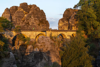 Panoramic view of rocks and plants against sky