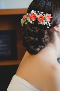 Close-up of woman wearing flowers