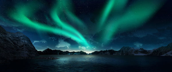 Scenic view of snowcapped mountains against sky at night