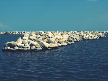 Scenic view of sea against clear blue sky