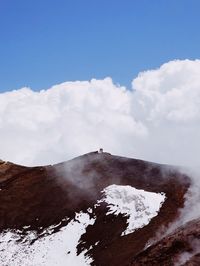 Scenic view of snow covered mountains against sky