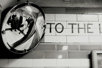 Close-up of text on tiled floor