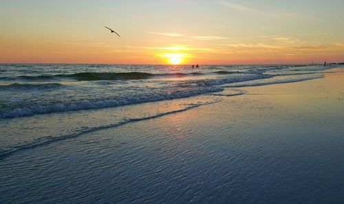 Scenic view of sea at sunset