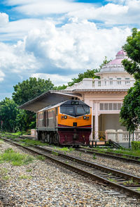 Train on railroad track against sky