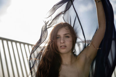 Portrait of beautiful woman with textile