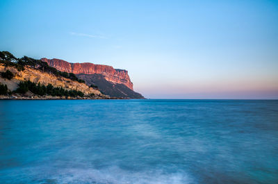 Scenic view of sea against clear blue sky