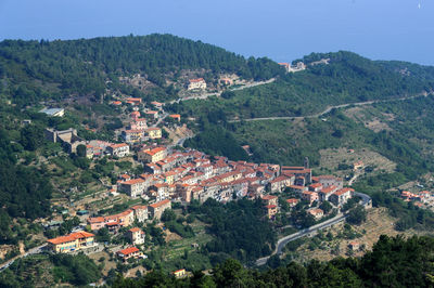 High angle view of townscape and mountains