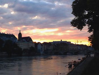 River against cloudy sky at sunset