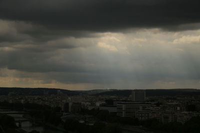 High angle view of cityscape against cloudy sky