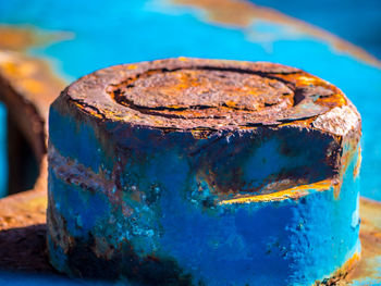 Close-up of rusty metal on table