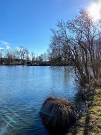 Scenic view of lake against blue sky