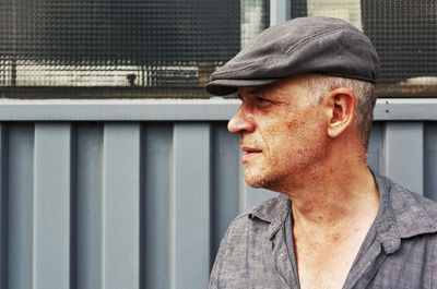Close-up of man wearing hat