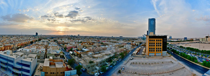 High angle view of buildings against sky during sunset