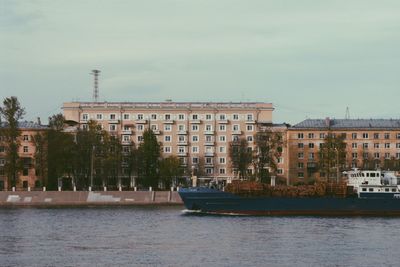 Buildings in city against sky