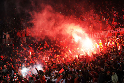 High angle view of people in stadium at night