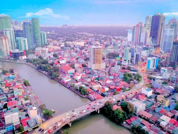 High angle view of buildings in city against sky