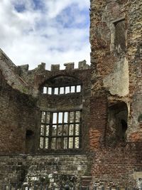 Low angle view of old building against sky