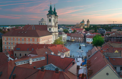 View of town against sky at sunset