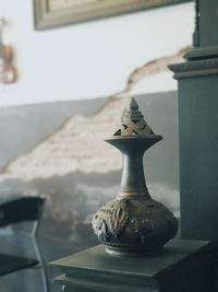 Close-up of an animal on table at home