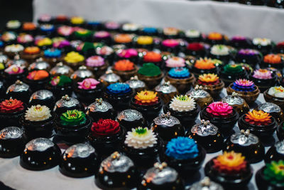 Close-up of multi colored candles on table