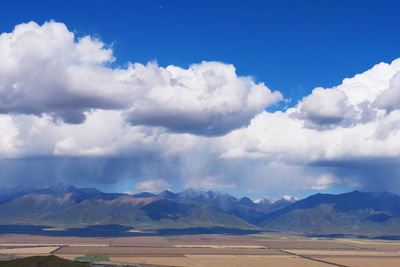Scenic view of landscape and mountains against sky
