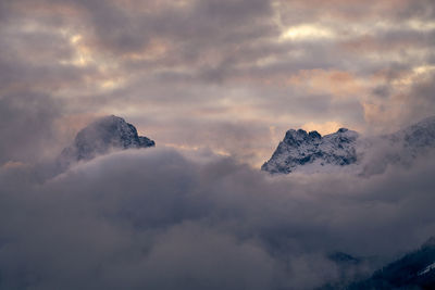 Low angle view of snowcapped mountain against sky during sunset