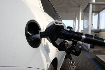 Close-up of fuel pump refueling car at gas station