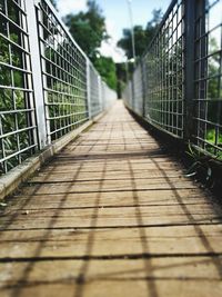 Close-up of footbridge against sky