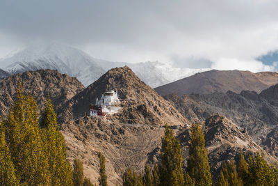 Panoramic view of land and mountains against sky