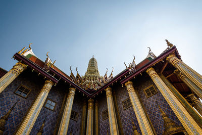 Low angle view of temple building against clear sky in the grand palace in bangkok, thailand.