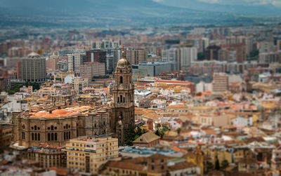 High angle view of church and buildings in city