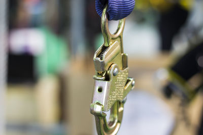 Close-up of chain hanging on metal