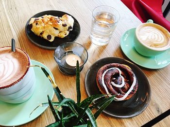 High angle view of coffee served on table