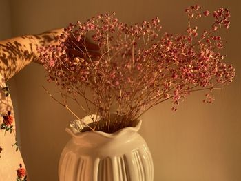 Close-up of white flower vase on table