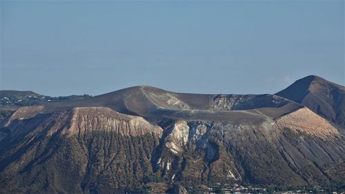 Panoramic view of volcanic mountain against clear sky