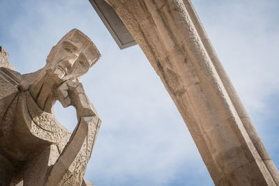 Low angle view of statue against sky