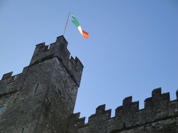 Low angle view of built structure against clear blue sky