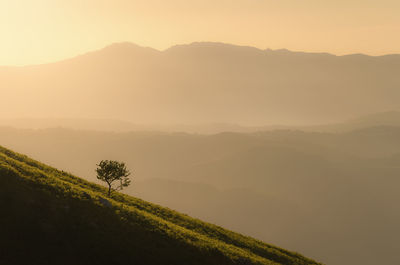 Scenic view of mountains against sky during sunset