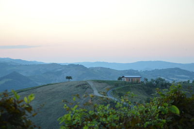 Scenic view of landscape and mountains against sky