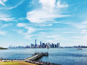 Panoramic view of buildings in city against sky