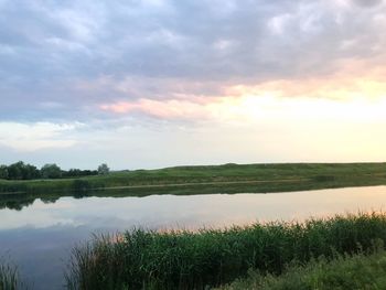 Scenic view of lake against sky during sunset