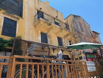 Low angle view of old building against blue sky