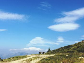 Scenic view of landscape against blue sky