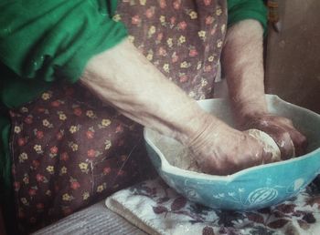 Low section of woman standing on tiled floor