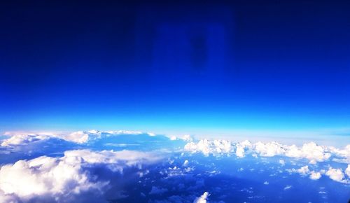 Aerial view of clouds against blue sky