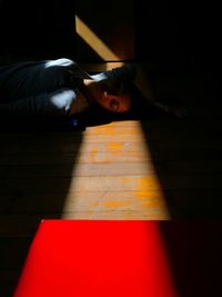 Young woman lying on floor